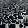 Stack of steel pipes with depth of field effect, 3d illustration